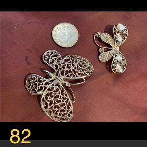 Two butterfly brooches
